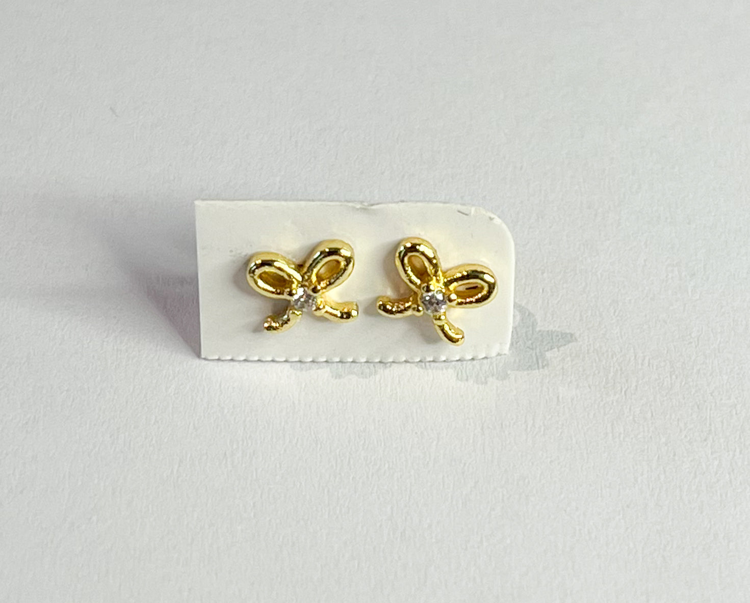 Gold-plated bow earrings with safety backings