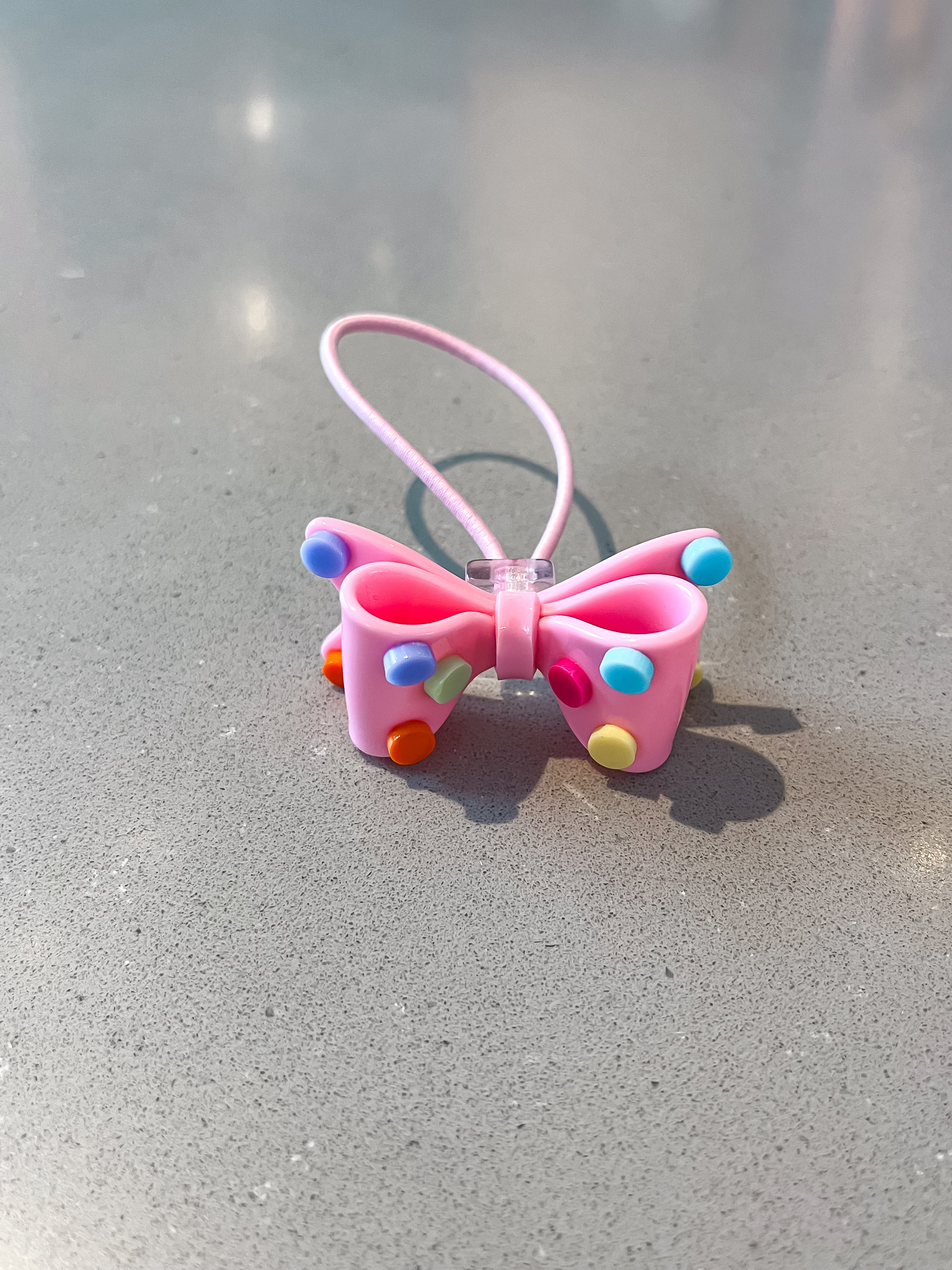 Acrylic bow with polkadots hair tie
