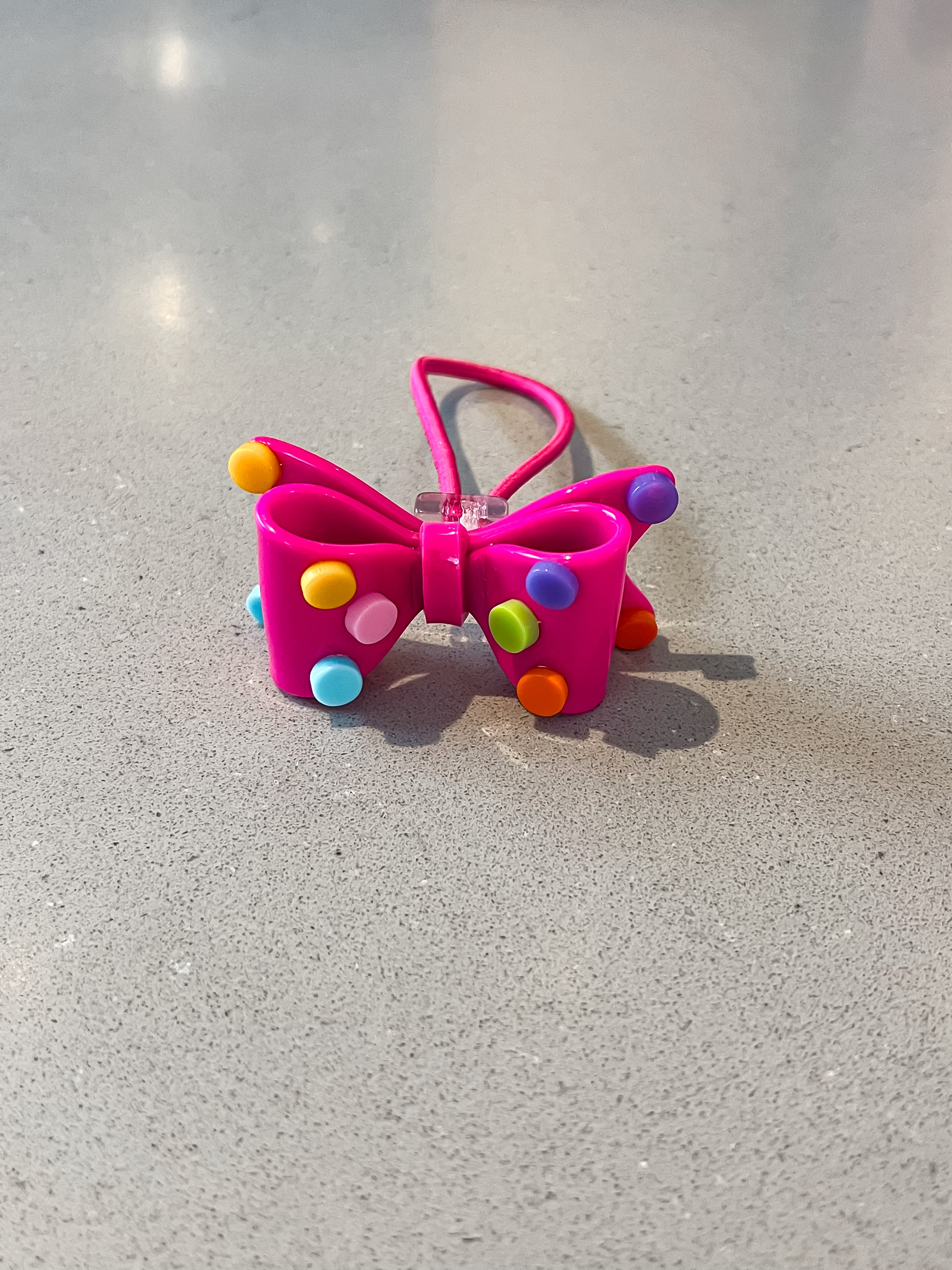 Acrylic bow with polkadots hair tie