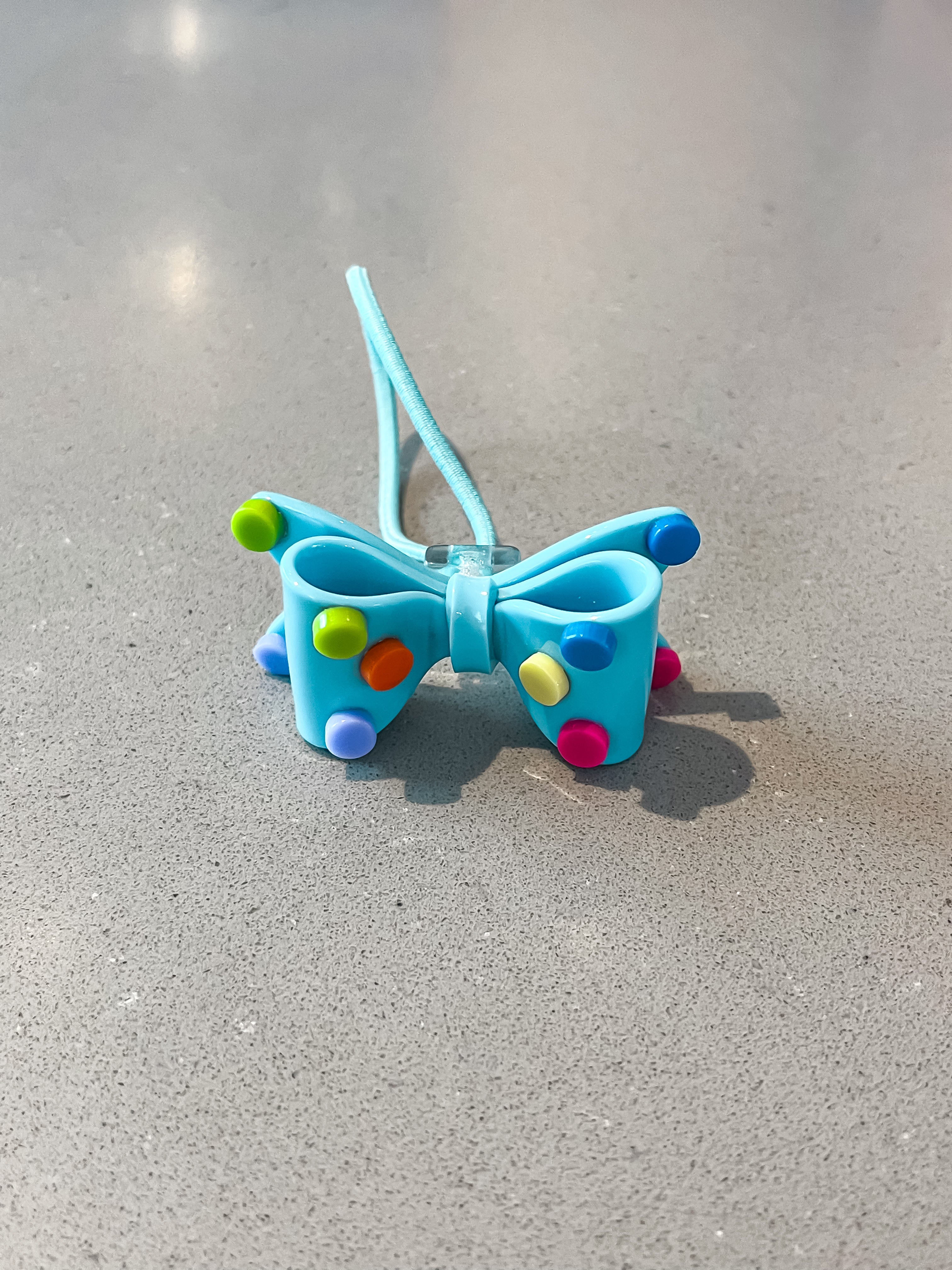 Acrylic bow with polkadots hair tie