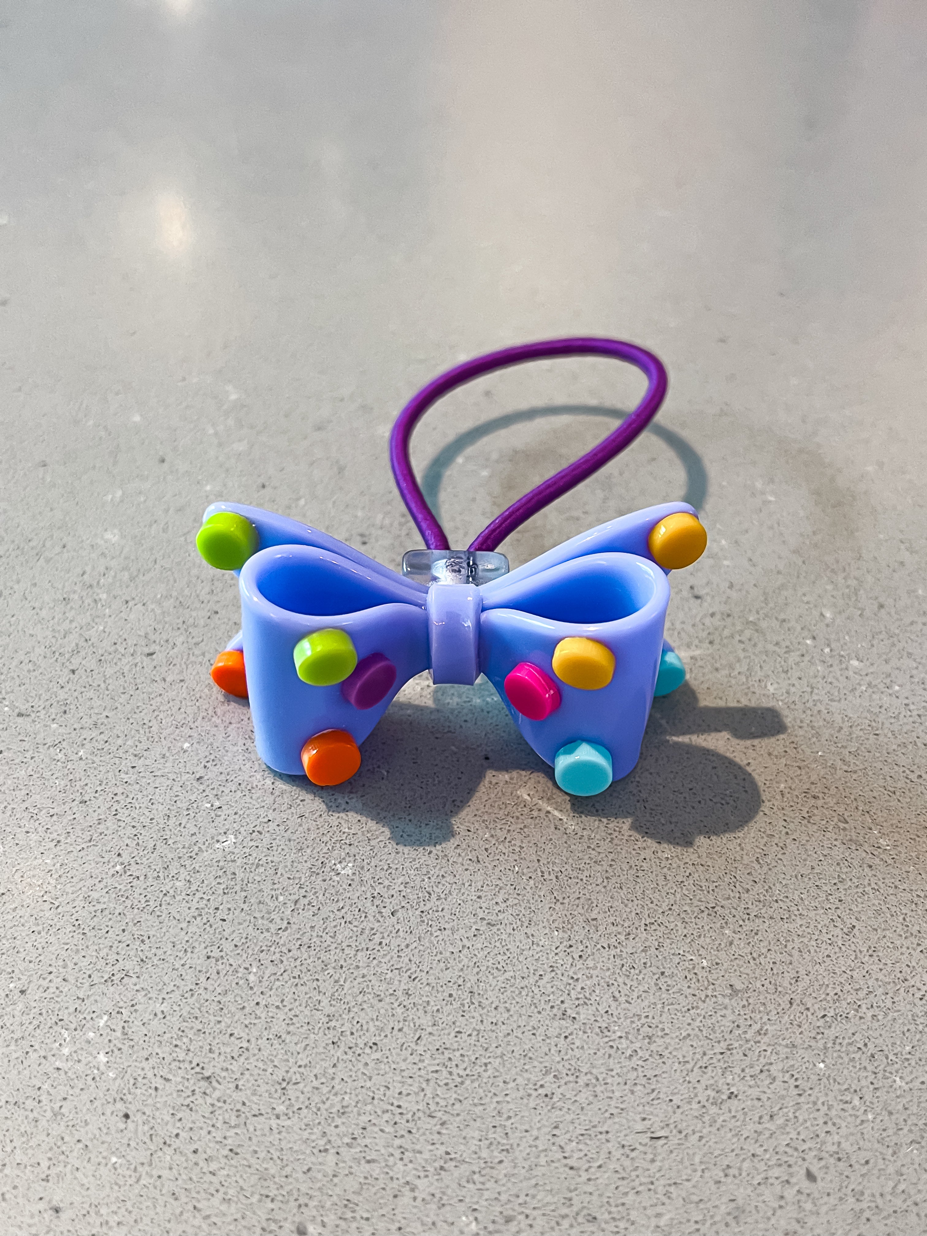 Acrylic bow with polkadots hair tie