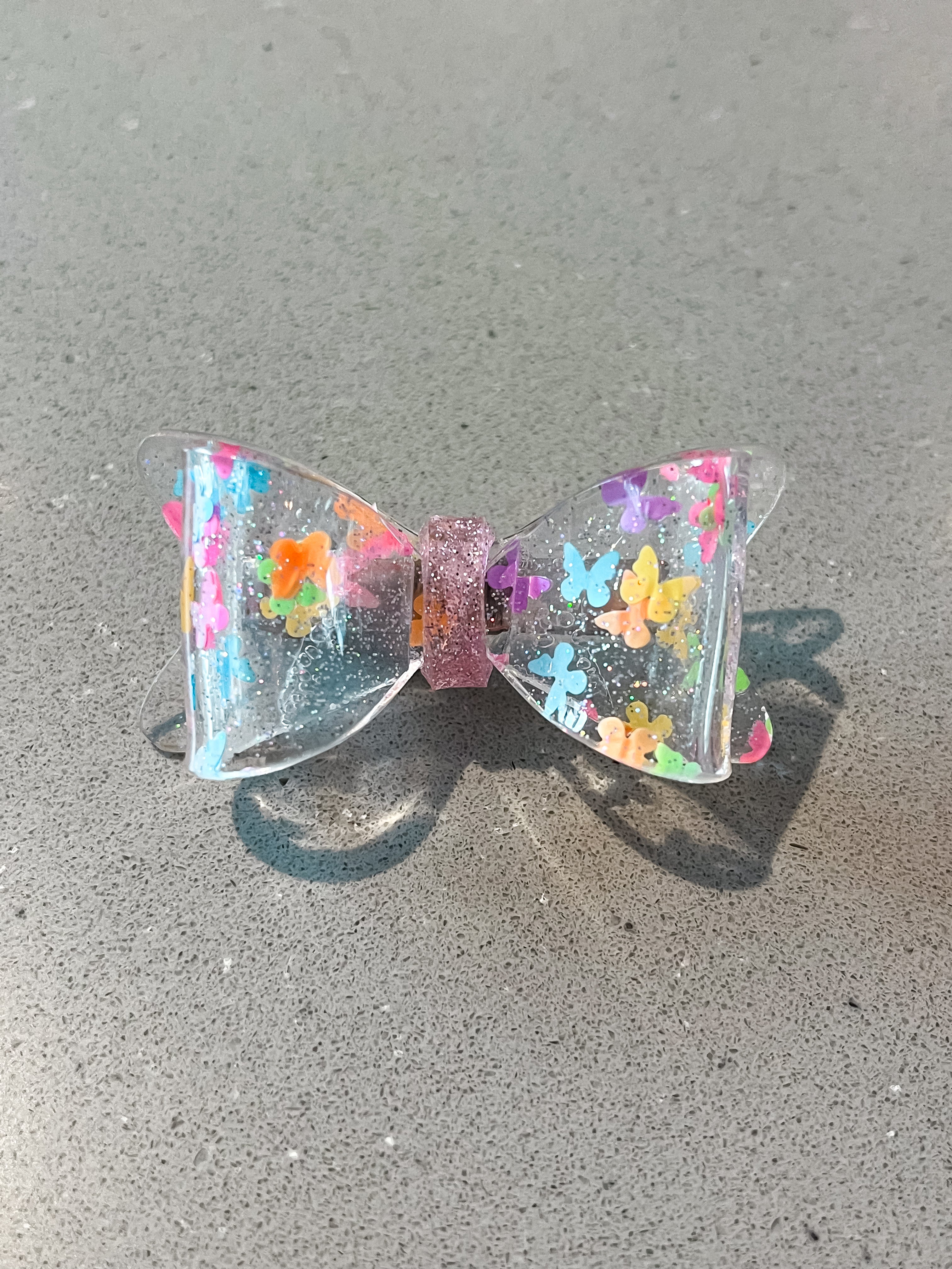Sparkly clear bow with multicolor butterflies hair clip